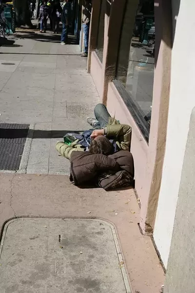 THIS LOOKS LIKE A GOOD PLACE TO SLEEP: OK, technically this could just be a homeless guy, but I couldn’t find any passed-out drunk kids. - PHOTO BY GLEN STARKEY