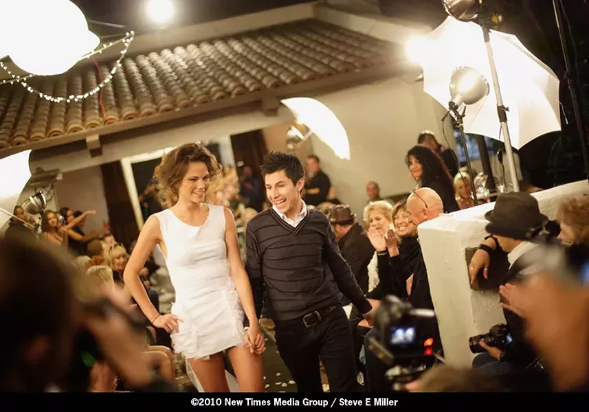 MAN OF THE HOUR! : Designer Francisco Castro and one of the models soak in the accolades after last Friday’s show. May 21 will feature the collections of designer Kristina Michelle. - PHOTO BY STEVE E. MILLER
