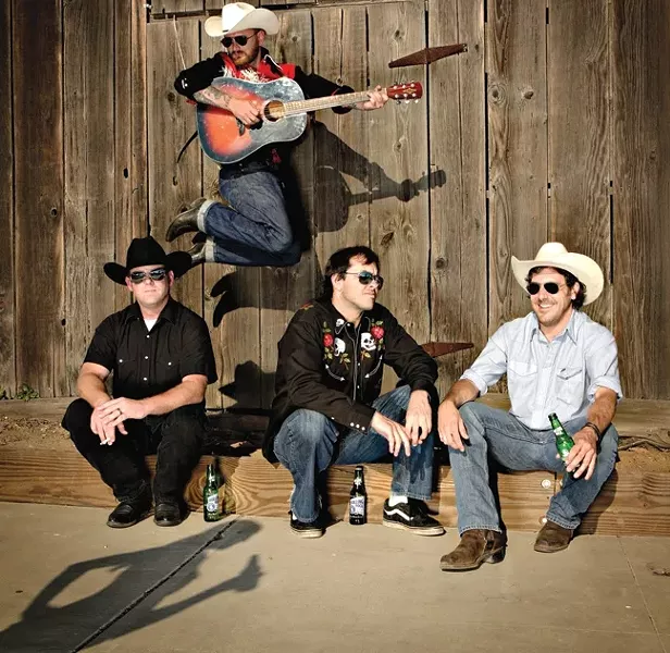 BEFORE THE BULLS : Local hardscrabble country act Redeye Junction plays the Mid-State Fair’s Castaways Stage right before the Professional Bull Riding finals on Aug. 3. Yeehaw! - PHOTO BY STEVE E. MILLER
