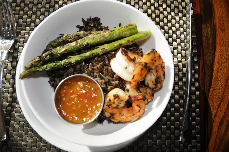 LOOKIN’ GOOD: The prawn rice bowl with sauteed jumbo prawns and grilled asparagus over wild rice. - PHOTO BY DAN HARDESTY