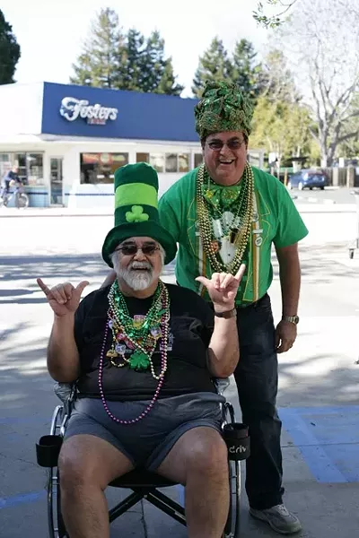 FRIENDS IN NEED: John Parker wheels his friend Joe Halpen into McCarthy’s around 11 a.m. on Monday, March 17. - PHOTO BY GLEN STARKEY