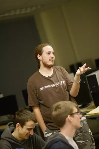 PUZZLE SOLVERS : Jon Moorman, Evan Ralston, and Eriq Augustine spent 48 hours in one room designing and building their game Road to Redemption. - PHOTO BY STEVE E. MILLER