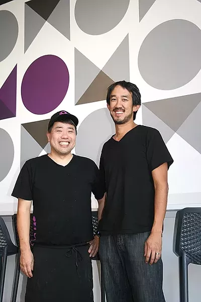 PEACEMAKERS: From left, Oki Momo Asian Grill chef/co-owner In Lloyd and co-owner Jonathan Yeh aim to bring all facets of the food community together for a balanced, delicious meal. - PHOTO BY HAYLEY THOMAS