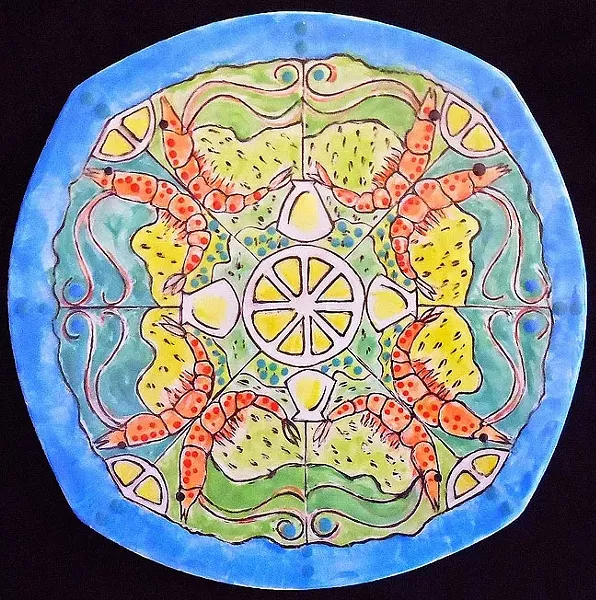 SEE FOOD: This colorful plate adorned with crustaceans by glass artist Larry Le Brane would be the perfect vessel for a steaming serving of shrimp scampi. - PHOTO COURTESEY OF PASO ROBLES CITY LIBRARY