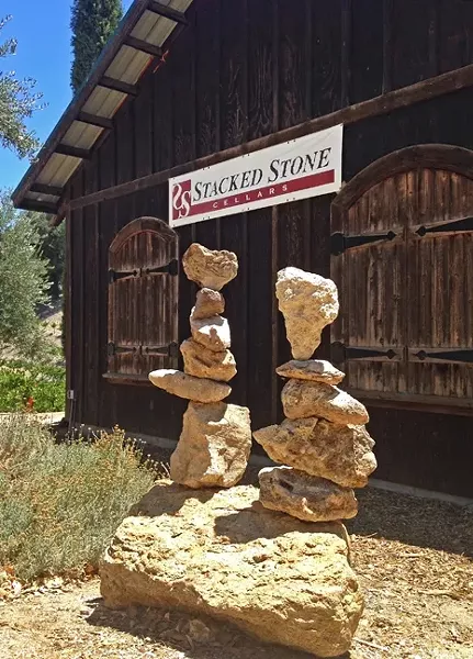 STACKS ON STACKS: Clarke’s signature piece, a heart-shaped rock, can be seen in her rock balances for the appropriately-named Stacked Stone Cellars in Paso Robles. - PHOTO COURTESY OF KATHY CLARKE