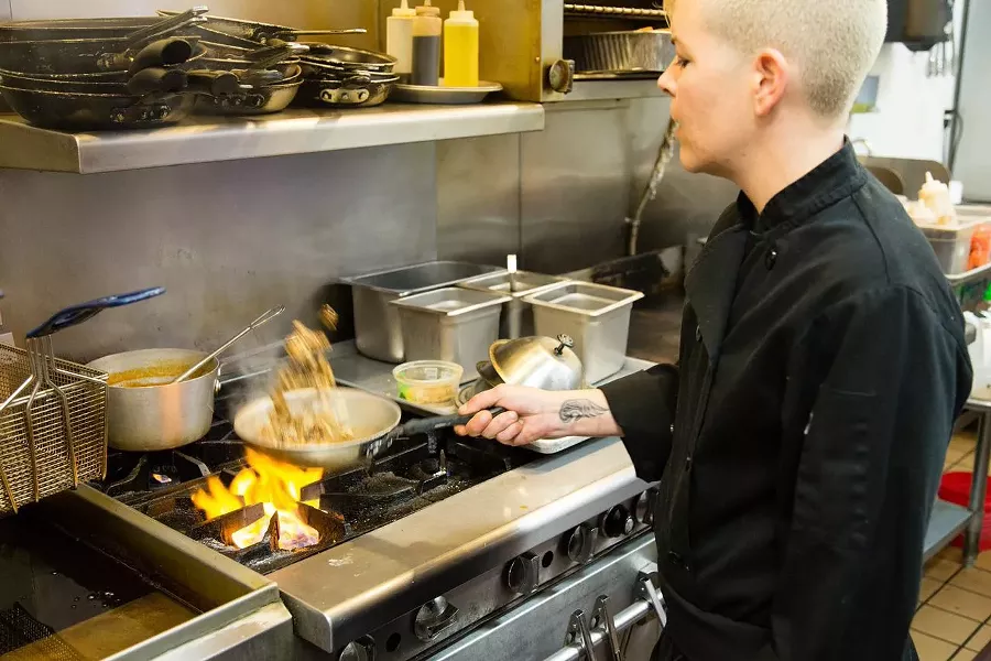 COOKING CONFUCIUS: Food truck renegade-turned-restaurateur Lori Nunes is known for serving up globally-inspired eats peppered with pure joy. Edible enlightenment is now served daily at the Pismo Beach location. - PHOTO BY TOM FALCONER