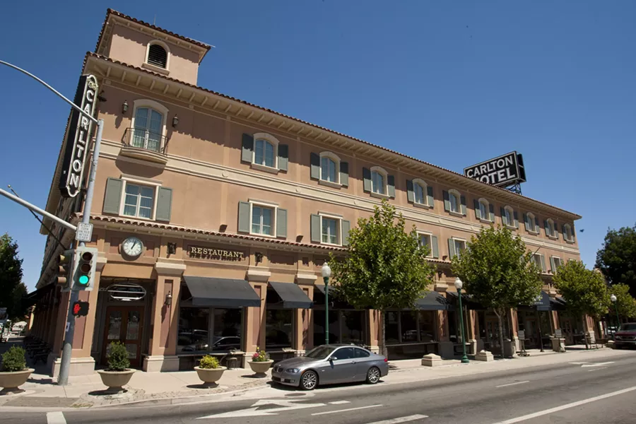 HEARTBREAK HOTEL : It was a close call, but it seems the Carlton Hotel won’t be going to auction after owner David Weyrich made the first payment toward his enormous tax debt. - FILE PHOTO BY STEVE E. MILLER