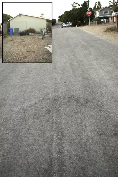 THE SCENE : The house, left, is where the shooting happened. The victim ran to the middle of the street, right, before he fell and died. - PHOTOS BY STEVE E. MILLER