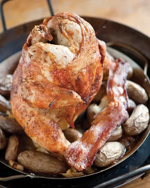 OM NOM NOM: Remove chicken from oven and let it rest for 10 minutes or so, and finally serve chicken with potatoes and bacon crumbles. - PHOTO BY STEVE E. MILLER