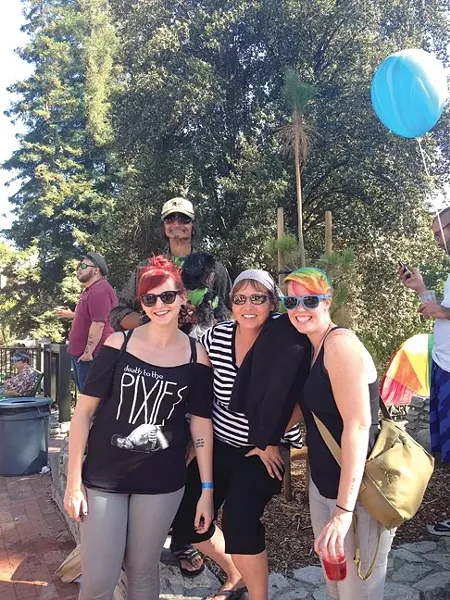 YOU’VE GOT A FRIEND IN ME: Friends Emily Katyryniuk, Peter Zepeda, Dice the wonder dog, Jaime Baker, and Aileen Manley soak up some sun and pride. - PHOTO BY MAEVA CONSIDINE