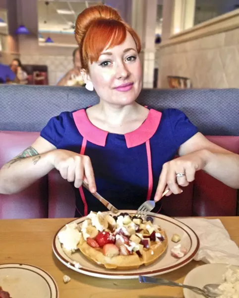 DINER QUEEN: Digging into a plate of “Alaskan Waffles,” aka waffles topped with vanilla ice cream at a dive-tastic diner in old Las Vegas earlier this year. Dessert disguised as breakfast is my husband’s favorite treat. This is obviously his meal. - PHOTO COURTESY OF HAYLEY THOMAS