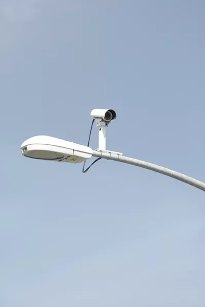 SMILE! : Don’t worry; all those cameras at intersections are just for traffic, not surveillance. But that could change. - PHOTOS BY STEVE E. MILLER