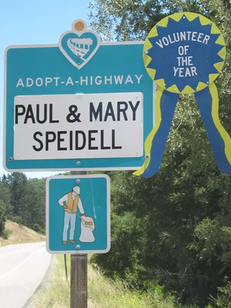 SIGN OF THEIR TIME: Paul and Mary Speidell were honored in 2011 by Caltrans with this ribbon placed on their road sign, recognizing their 25 years of picking up litter - on Highway 46 West. - PHOTO COURTESY OF CALTRANS