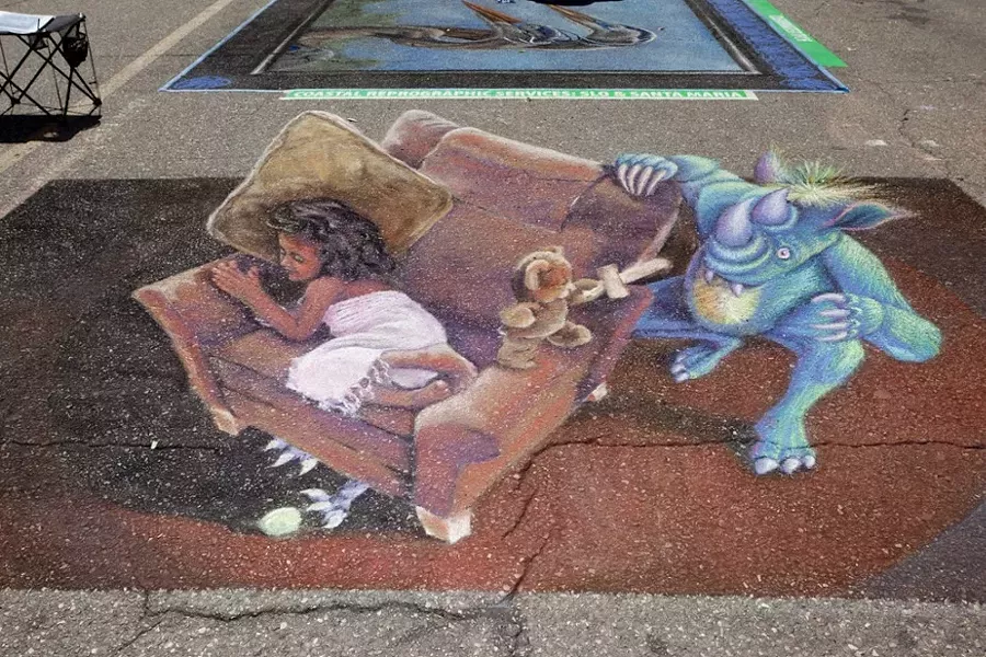 INTO ANOTHER DIMENSION: Some of the most popular works featured at SLO’s street painting festival utilize forced perspective to create images that appear three-dimensional. - PHOTO BY JOSEF KASPEROVICH