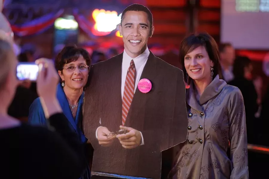 INAUGURAL BALL : Simone Viola (right) and Pirtza Abuan (left) pose with President Obama's cutout at The Graduate. - PHOTO BY STEVE E. MILLER