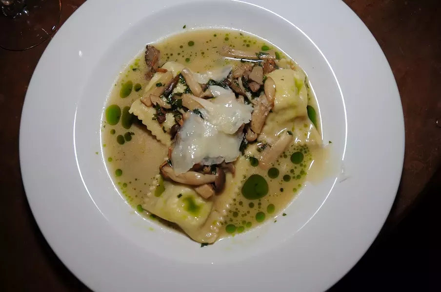 FOOD!: Ember’s housemade green garlic ravioli with wild and king trumpet mushrooms, Rutiz Farms mint, and grana padano are irresistibly delicious. - PHOTO BY DAN HARDESTY