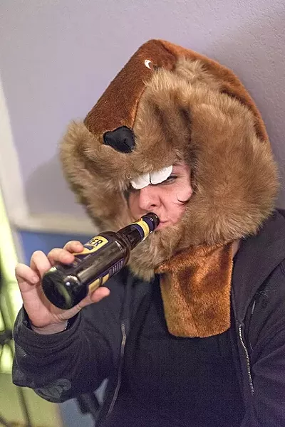 VARMINT CONG: “In the immortal words of Jean-Paul Sartre, ‘Au revoir, gopher,’” says friend and former Calendar Editor, Maeva Considine, at Colin and Ashley’s going-away shindig. - PHOTO BY JESSICA PEÑA