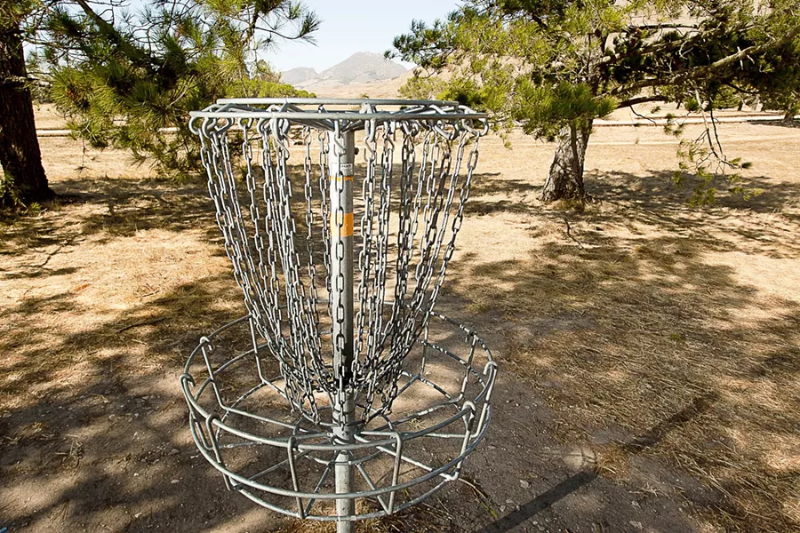 SLIP A DISC : The SLO Throwers, a local disc-golf club, has been instrumental in setting up disc golf courses around San Luis Obispo County, including this one at Laguna Lake, - PHOTO BY STEVE E. MILLER