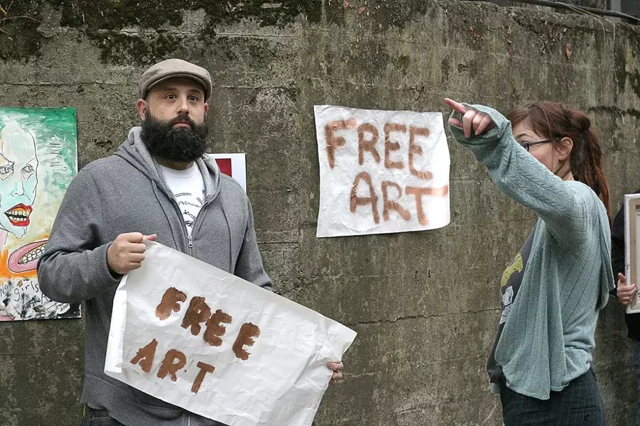 CO-CONSPIRATORS! : Neal Breton (the one with the puzzled look on his face) will run an “art truck” and New Times editor Ashley Schwellenbach (hiding behind her own arm) will orchestrate the shenanigans of the entire Box City event on Feb. 25. - PHOTO BY GLEN STARKEY