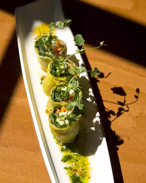 OPTIONS FOR EVERYONE : Chef Shawn Behrens wants everyone to be able to eat at Luna Red, so his menu has notations to show which food items are available as gluten free or vegan or both. Pictured here: veggie stuffed coconut milk crepes with a chili lime sauce. - PHOTO BY STEVE E. MILLER