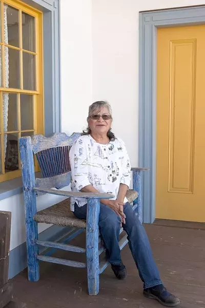 TALKS ON THE VERANDA: Dana Adobe docent Helen Daurio recently delivered a talk about frontiersman James P. Beckwourth from the veranda of the Dana Adobe in Nipomo. - PHOTO BY STEVE E. MILLER