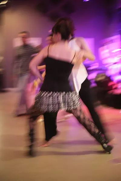 MALE SHORTAGE : A couple gals take to the dance floor when male partners aren’t available. - PHOTO BY GLEN STARKEY