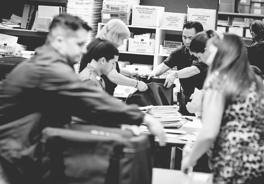 BALLOTS, BALLOTS EVERYWHERE: Despite low turnout—only 31.2 percent of registered voters cast a ballot, though that figure is expected to rise—officials in the SLO County Clerk-Recorder Office furiously counted ballots on June 3. Most races were fully reported by about 11 p.m. that night. - PHOTO BY HENRY BRUINGTON