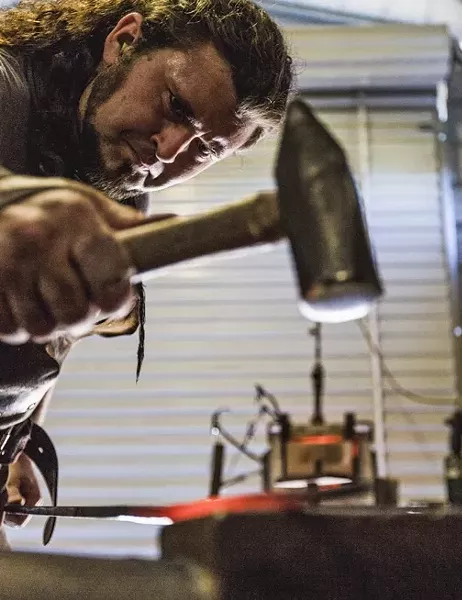 TINKER TAILOR : Randolph hammers the scorching steel to draw it out and elongate it. - PHOTO BY KAORI FUNAHASHI