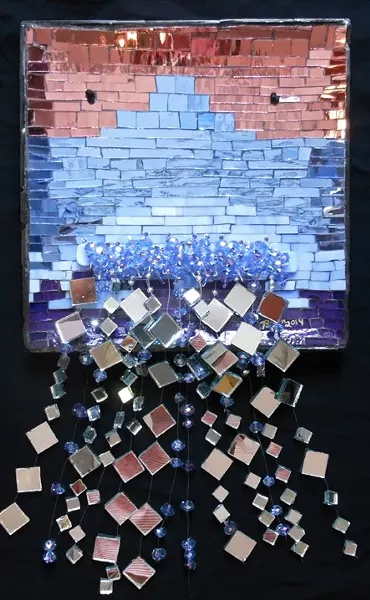 BOOKHEMIAN RHAPSODY: Atascadero artist Bryn Bridenthal worked and toured with the band Queen during their prime. Her bookplate, made of fused glass, embodies that band - era’s kind of magic. - PHOTO COURTESY OF PASO ROBLES CITY LIBRARY