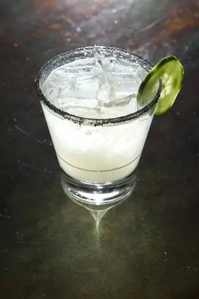 BETWEEN THE SHEETS: A creation of Novo’s Matt Hanson, the mixture of top-shelf tequila, serrano peppers, and black lava salt makes The Latin Linen a spicy—but subtle—choice for any weather. - PHOTO BY STEVE E. MILLER