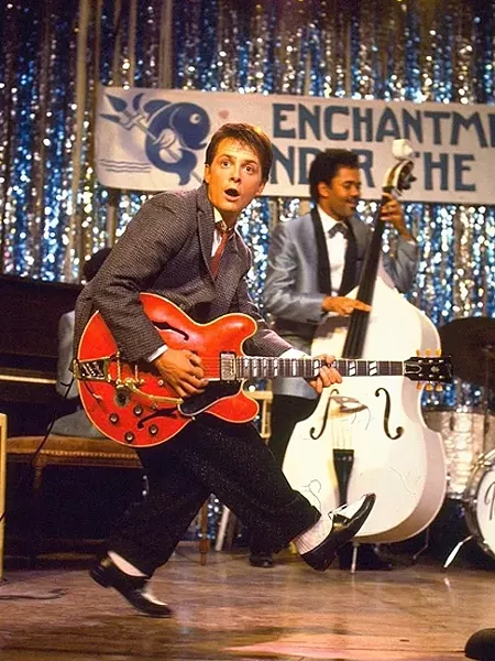 JOHNNY B. GOODE! : Marty McFly (Michael J. Fox) “invents” rock ’n’ roll when he travels back in time and plays a dance at his parents’ high school. - PHOTO COURTESY OF UNIVERSAL PICTURES AND AMBLIN ENTERTAINMENT