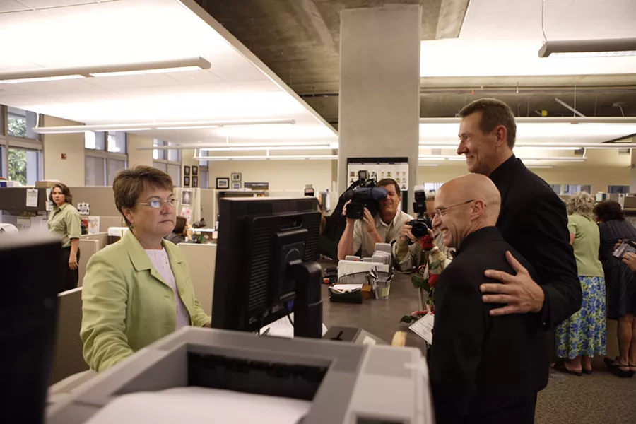 FIRST IN SLO : Gerald Lindemulder (right) and David Robinson were the first gay men in SLO County to be legally married by County Clerk-Recorder Julie Rodewald on June 16, 2008. - PHOTO BY STEVE E. MILLER