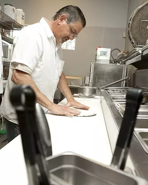TICKLING THE TASTE BUDS: Phil Silver, owner of Pi Whole, plays with some wild ingredients, including brown sugar, macadamia nut, pineapple, coconut, pickle, and yellow mustard. - PHOTO BY STEVE E. MILLER