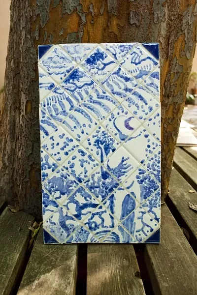 BLUE SKIES : Traditional Portuguese azulejos are generally comprised of porcelain tiles painted with cobalt blue. Many of Freear’s tiles, however, deviate from the expected monochromatic, pastoral scenes. - PHOTO BY STEVE E. MILLER