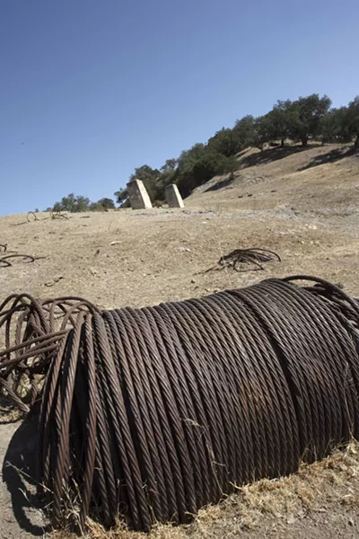 VALLEY TRASH : Previous drilling operations have scarred Huasna with leaking wells and leftover trash. Ironically, Excelaron had to pay for an anthropological study to determine if the leftover debris at the proposed drilling site was historically significant. - PHOTO BY STEVE E. MILLER