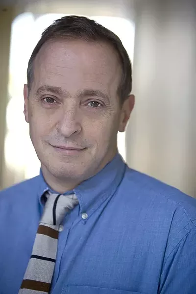 NOTHING CAN NOT BE IN YOUR LAP : David Sedaris talks bedbugs and unicorn-shaped uteri with New Times. - PHOTO BY ANNE FISHBEIN