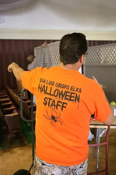 IT’S TED!: Ted directs his crew of Elks Lodge volunteers as they create a fun and safe alternative to Trick or Treating. - PHOTO BY GLEN STARKEY