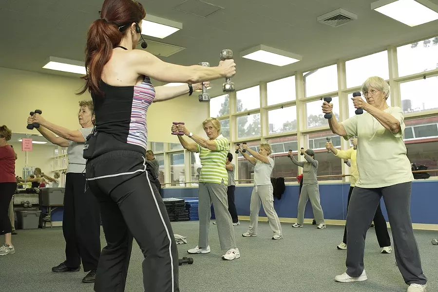 THIN LIZZIE : San Luis Coastal Unified School District offers strength training, body conditioning, aerobic, and flexibility classes at 1500 Lizzie St. in SLO, such as this one led by Michele Vanderlinde. - PHOTO BY STEVE E. MILLER