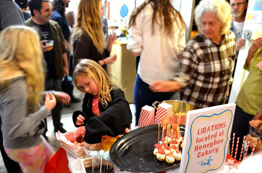 FOOD GLORIOUS FOOD!: Courtesy of HoneyBee Cakery, Bunker resident Liz Nagel, the Spring Art Spectacular featured quite the delicious spread of goods and sweets, from strawberry shortcake pops to chocolate truffles and popcorn. - PHOTO BY JESSICA PEÑA