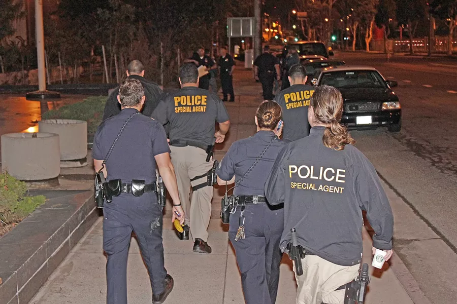 UNDER COVER OF NIGHT : U.S. Immigration and Customs Enforcement agents, working with local police officers, conducted an early morning gang “sweep” in Los Angeles. ICE has performed several similar sweeps on the Central Coast since 2006, focused primarily in Santa Maria, under a nationwide program called Operation Community Shield. - PHOTO COURTESY OF U.S. IMMIGRATION AND CUSTOMS ENFORCEMENT