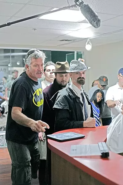 THE DIRECTOR: Adventure Club SLO leader John “Johnee” Gange (left) works with his cast at No Slack Studios on their new film "Revenge of Blue Harbor," premiering Dec. 6 at the Palm Theatre. - PHOTO BY GLEN STARKEY
