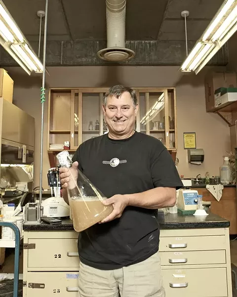 THE PITCH : Using 45-million-year-old yeast harvested from fossilized amber, Dr. Raul Cano, a Cal Poly microbiologist, brews beer. He’s used the same samples collected in 1996 to create the “pitch” used as a base in the brewing process. - PHOTO BY STEVE E. MILLER