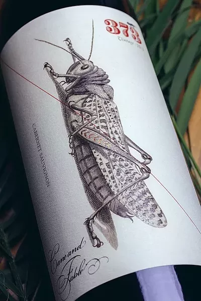 PUSHING YOUR COMFORT ZONE : A grasshopper graces Cane & Fable’s first offering, a public domain image Makers & Allies found and enhanced. - IMAGE COURTESY OF MAKERS & ALLIES