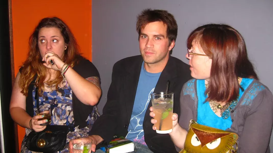 WORK PARTY : Maeva Considine, Colin Rigley, and Ashley Schwellenbach look in various directions while drinking fancy cocktails for a very public going away party that absolutely anyone could have attended.