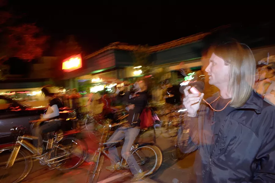 DRIVE-BY PARTY : Jevon Pyl leads a pack of bike riders in celebration of the inauguration. - PHOTO BY STEVE E MILLER