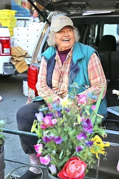 IN BLOOM: Ruth “The Flower Lady” Scovell of Orchard to You Farm in Atascadero has been selling at the Downtown SLO Farmers’ Market for the past 36 years. - PHOTO BY DYLAN HONEA-BAUMANN