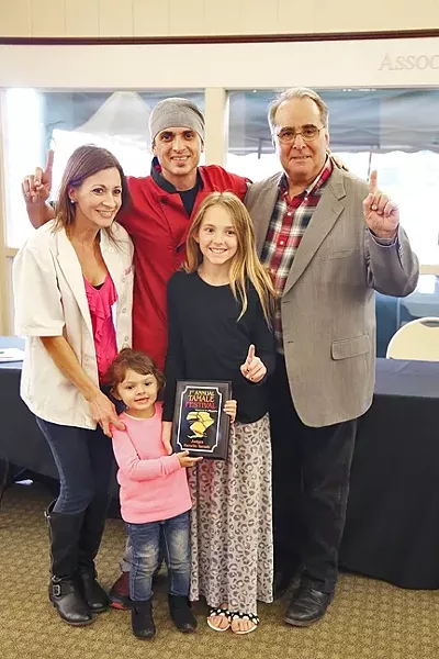 FAMILY FIRST: The family behind Shave ’N Flav—Steven Sullivan (chef), Brittany Torres (wife), Serenity Sullivan (youngest daughter), Sydney Sullivan (oldest daughter)—accepts their first place award for Judge’s Choice award from Atascadero Mayor Tom O’ Malley. - PHOTO BY DYLAN HONEA-BAUMANN