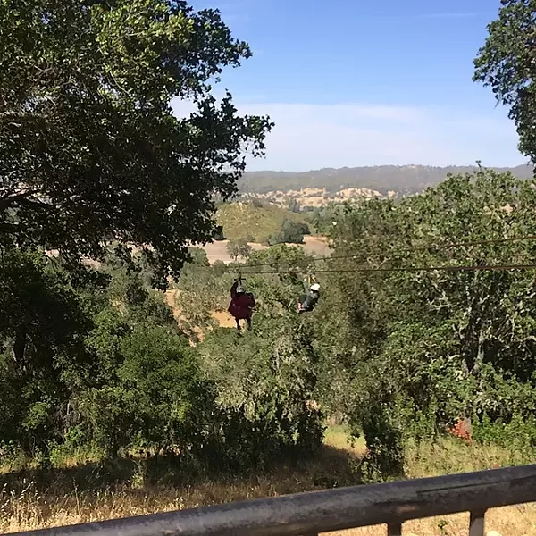 DOUBLE THE FUN: You can’t hold hands while you ride side by side on Margarita Adventure’s tandem zip line, but you can race! - PHOTO BY RYAH COOLEY