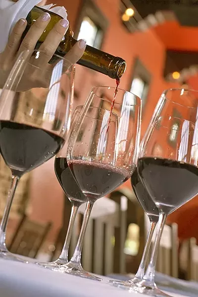 IT’S GOT LEGS: Wine tasting, events, and retail sales are a large factor of the SLO County wine industry’s economic impacts, according to a UC Davis study recently commissioned by the Paso Robles Wine Country Alliance. - PHOTO COURTESY OF PASO ROBLES WINE COUNTRY ALLIANCE