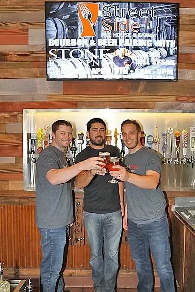 CHEERSING EACH OTHER ON: From left: Street Side Ale House co-owners Trevor LaSalle, Chris Durkin, and Taylor Reese. Not pictured: fellow co-owner Eric Peterson, who was hard at work creating a back patio for the Atascadero craft beer and comfort food hangout. - PHOTO BY DYLAN HONEA-BAUMANN